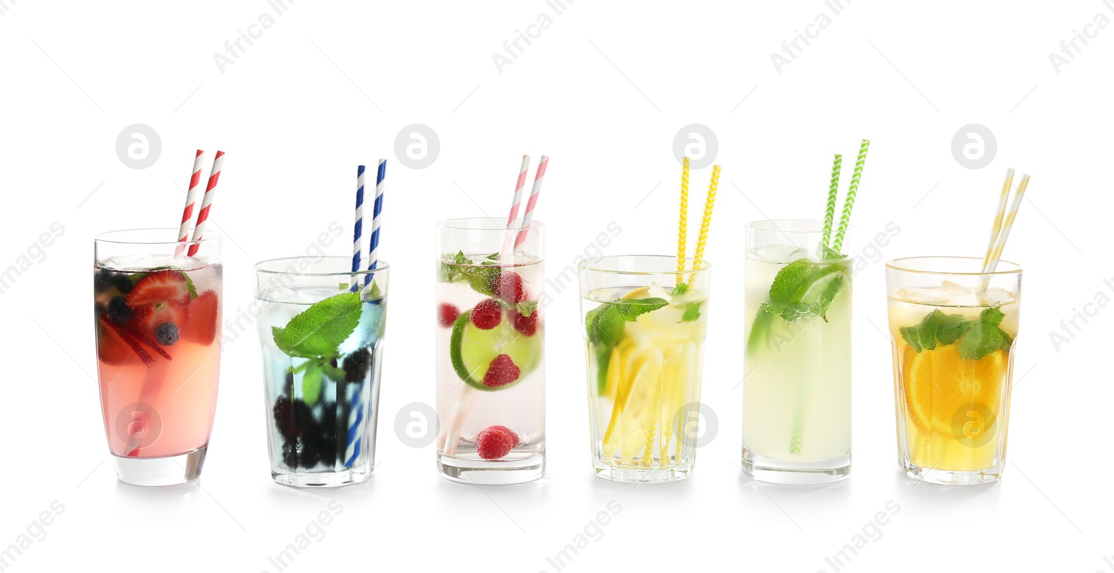 Photo of Glasses with tasty lemonades on white background