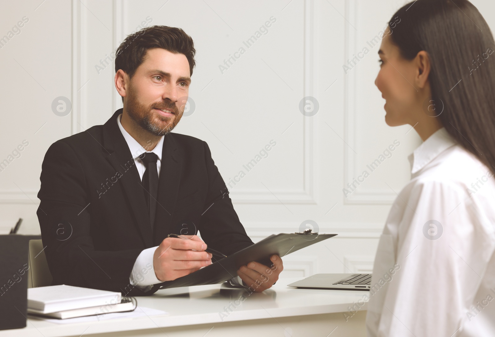 Photo of Human resources manager conducting job interview with applicant in office