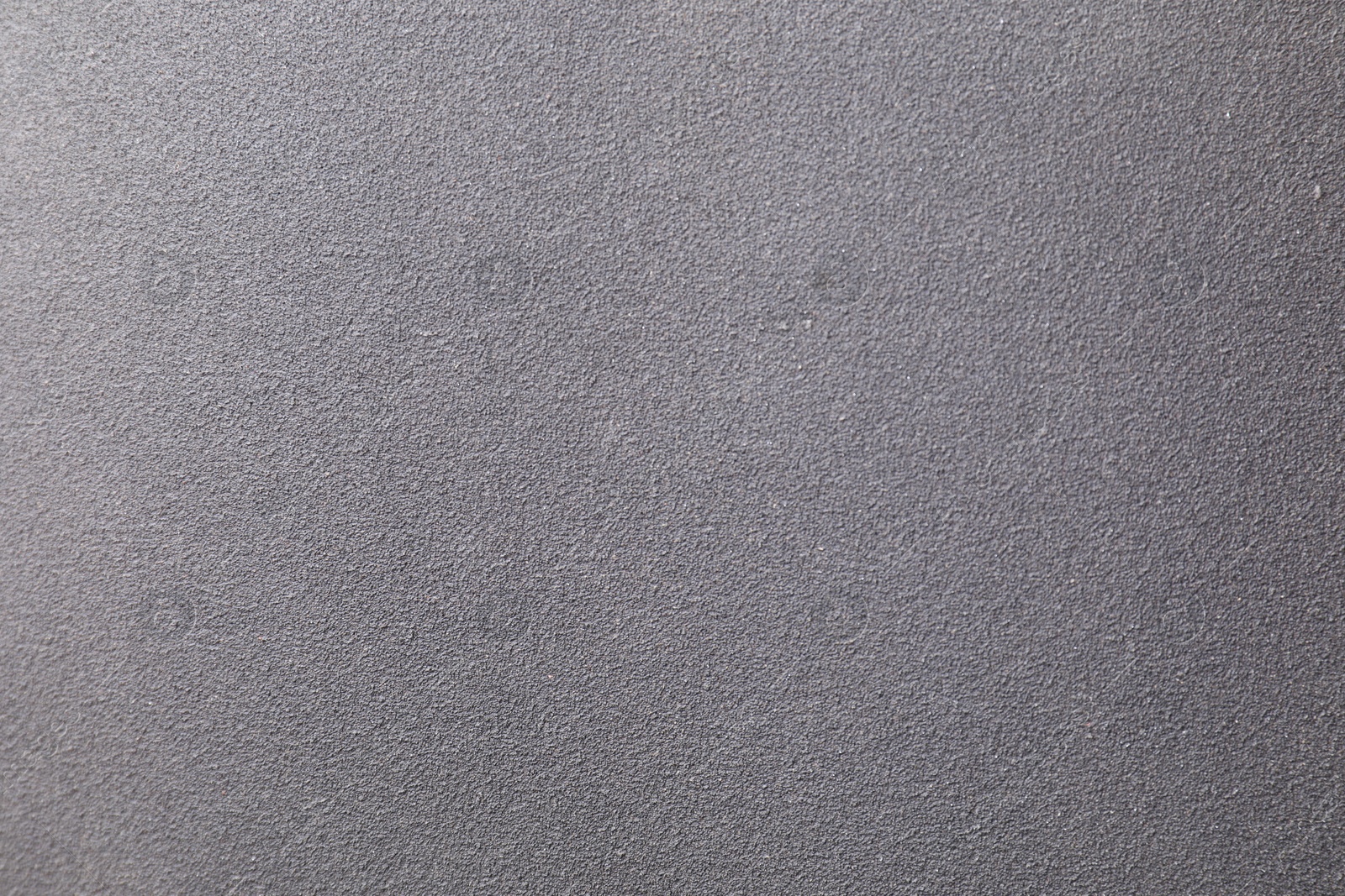 Photo of Texture of coarse sandpaper as background, top view