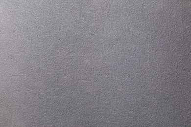 Texture of coarse sandpaper as background, top view