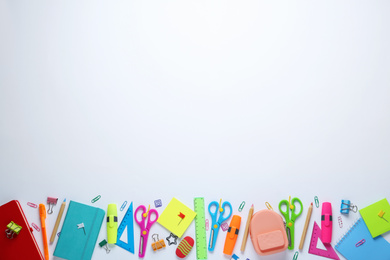 Different school stationery on white background, top view