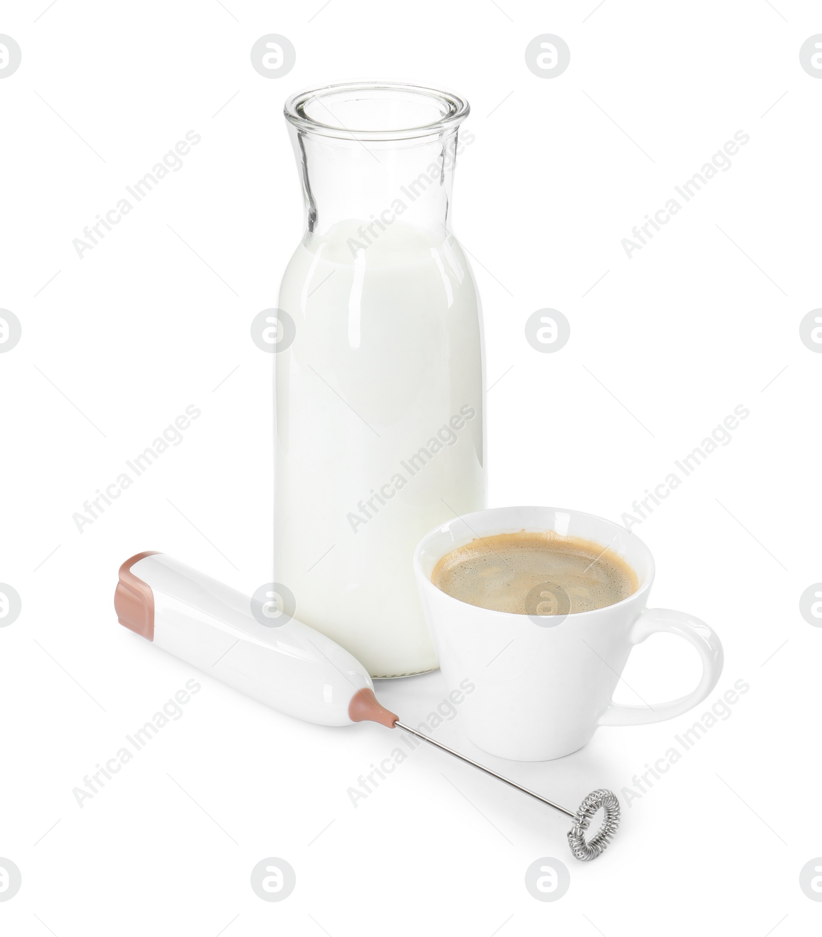 Photo of Mini mixer (milk frother), cup of coffee and bottle isolated on white