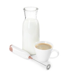 Mini mixer (milk frother), cup of coffee and bottle isolated on white