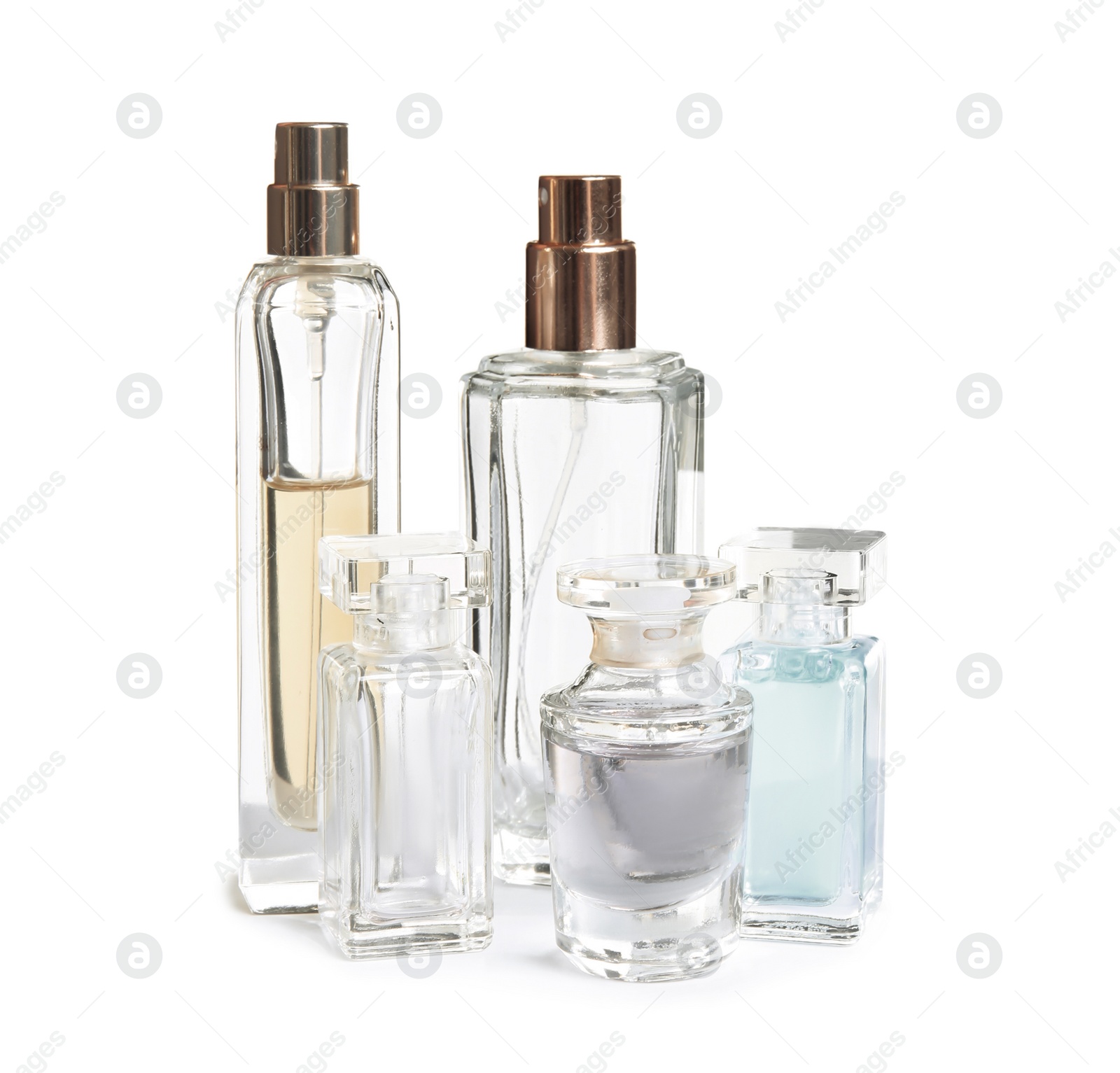 Photo of Different perfume bottles on white background