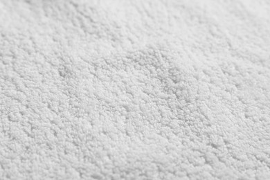 Photo of Texture of soft white towel as background, top view