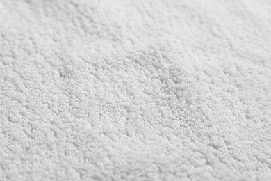 Texture of soft white towel as background, top view