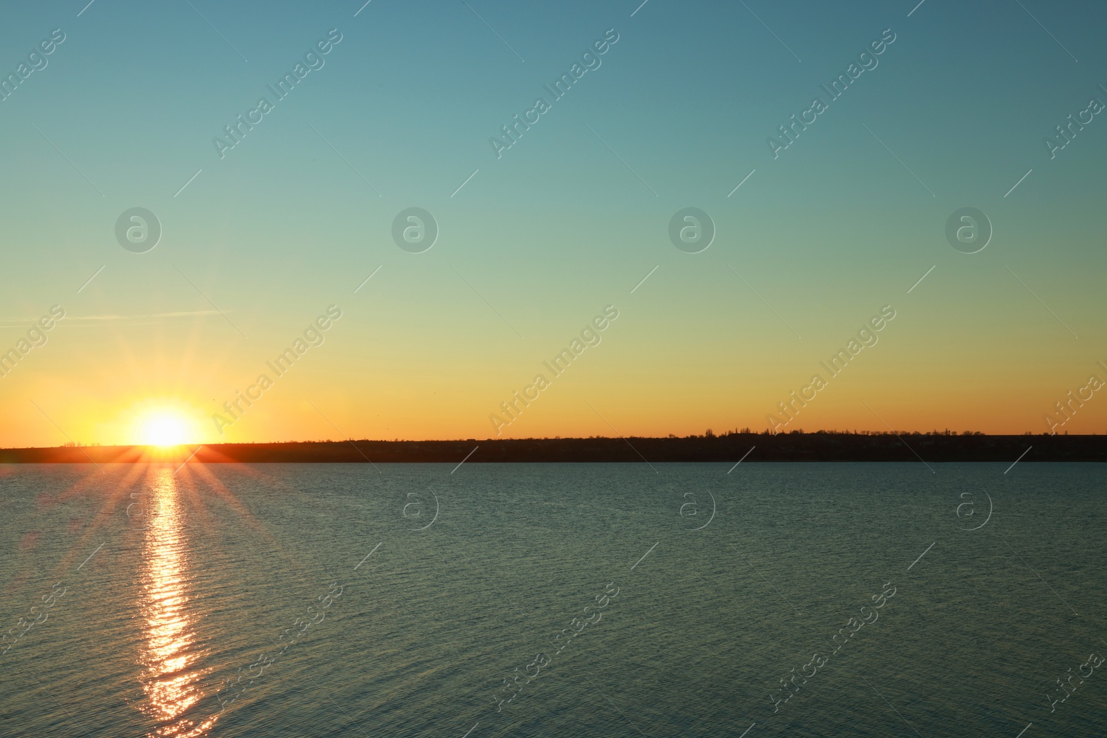 Photo of Picturesque view of beautiful sunset over calm river