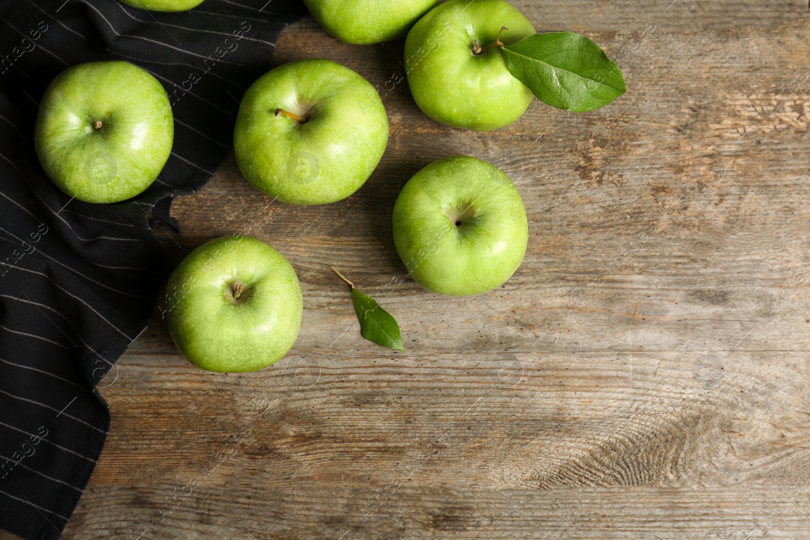 Photo of Fresh green apples on wooden background, top view