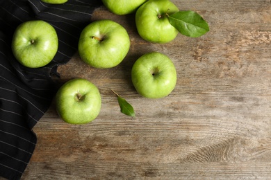 Photo of Fresh green apples on wooden background, top view