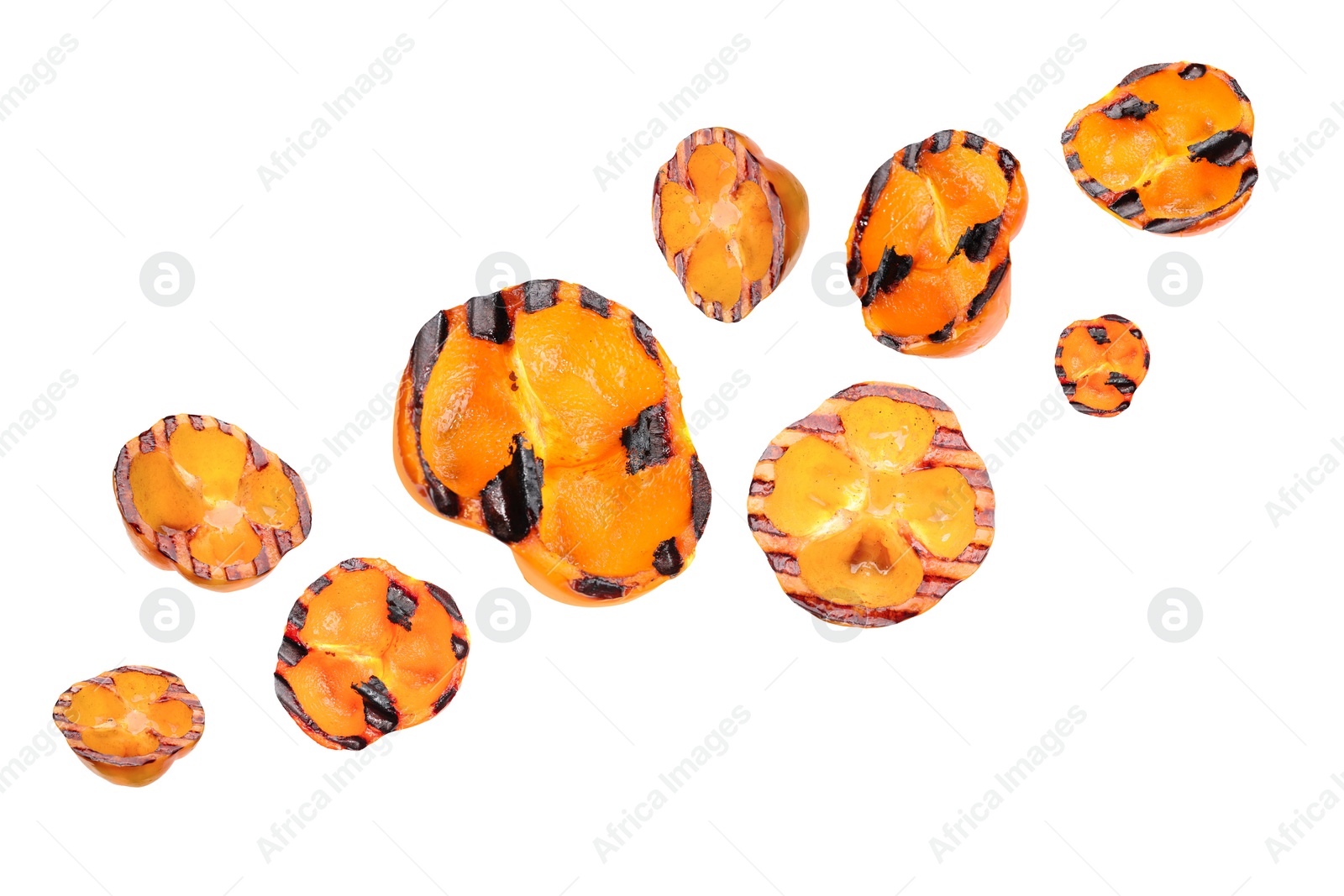 Image of Slices of grilled bell peppers in air on white background