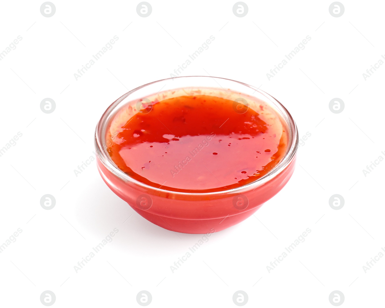 Photo of Spicy chili sauce in bowl isolated on white