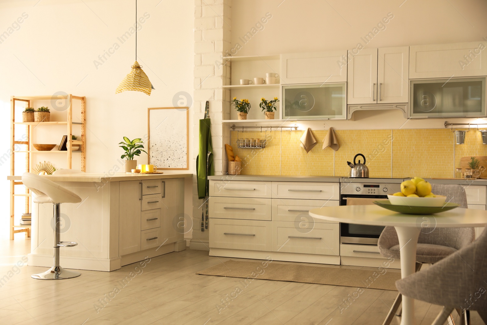 Photo of Modern kitchen interior with stylish white furniture