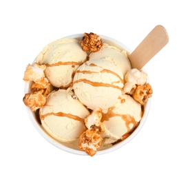Photo of Delicious ice cream with caramel popcorn and sauce in dessert bowl on white background, top view