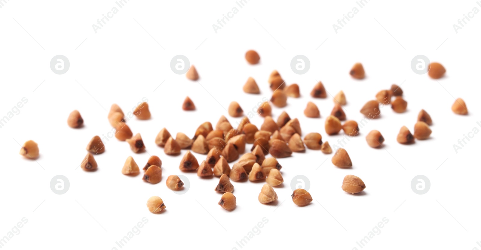 Photo of Buckwheat grains isolated on white. Organic cereal