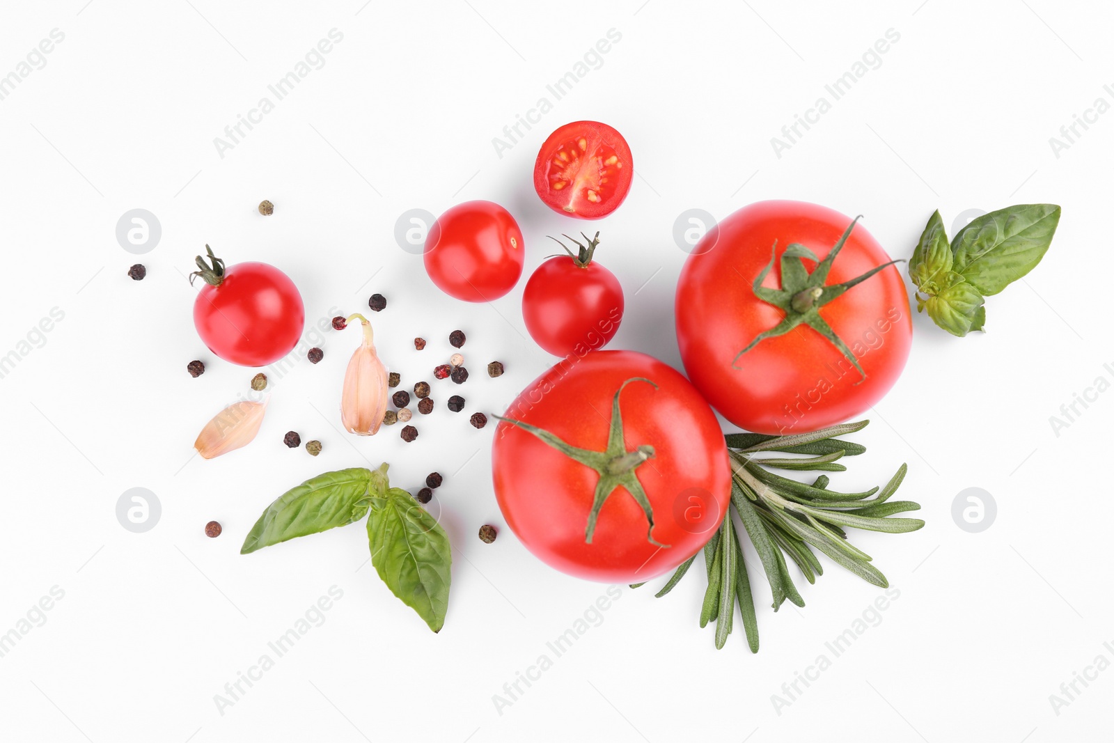 Photo of Flat lay composition with different whole and cut tomatoes on white background