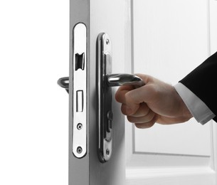 Photo of Man opening wooden door on white background, closeup