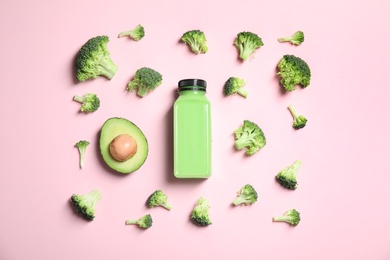 Photo of Flat lay composition with smoothie in bottle and ingredients on color background