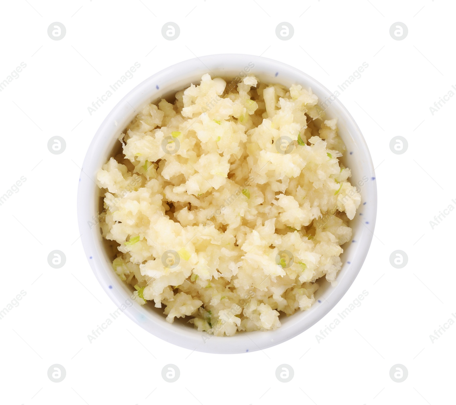 Photo of Chopped garlic in bowl isolated on white, top view