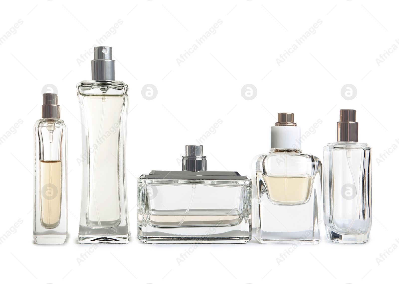 Photo of Different perfume bottles on white background