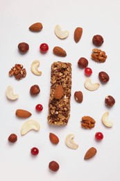 Tasty granola bar and ingredients isolated on white, top view