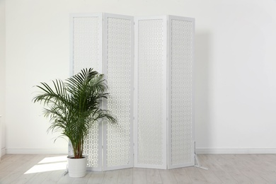 Photo of Modern folding screen in light spacious room