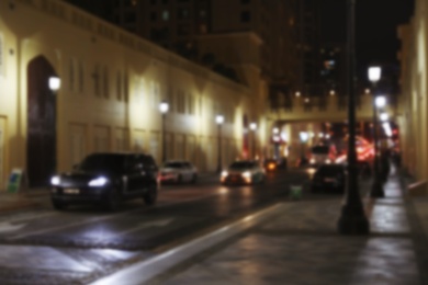 Photo of DUBAI, UNITED ARAB EMIRATES - NOVEMBER 03, 2018: Blurred view of city street traffic at night