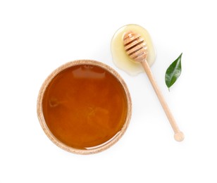 Photo of Tasty honey in bowl, dipper and green leaf on white background, flat lay