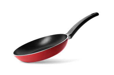 Modern red frying pan isolated on white