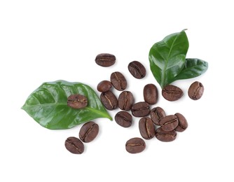 Roasted coffee beans with fresh leaves on white background, top view