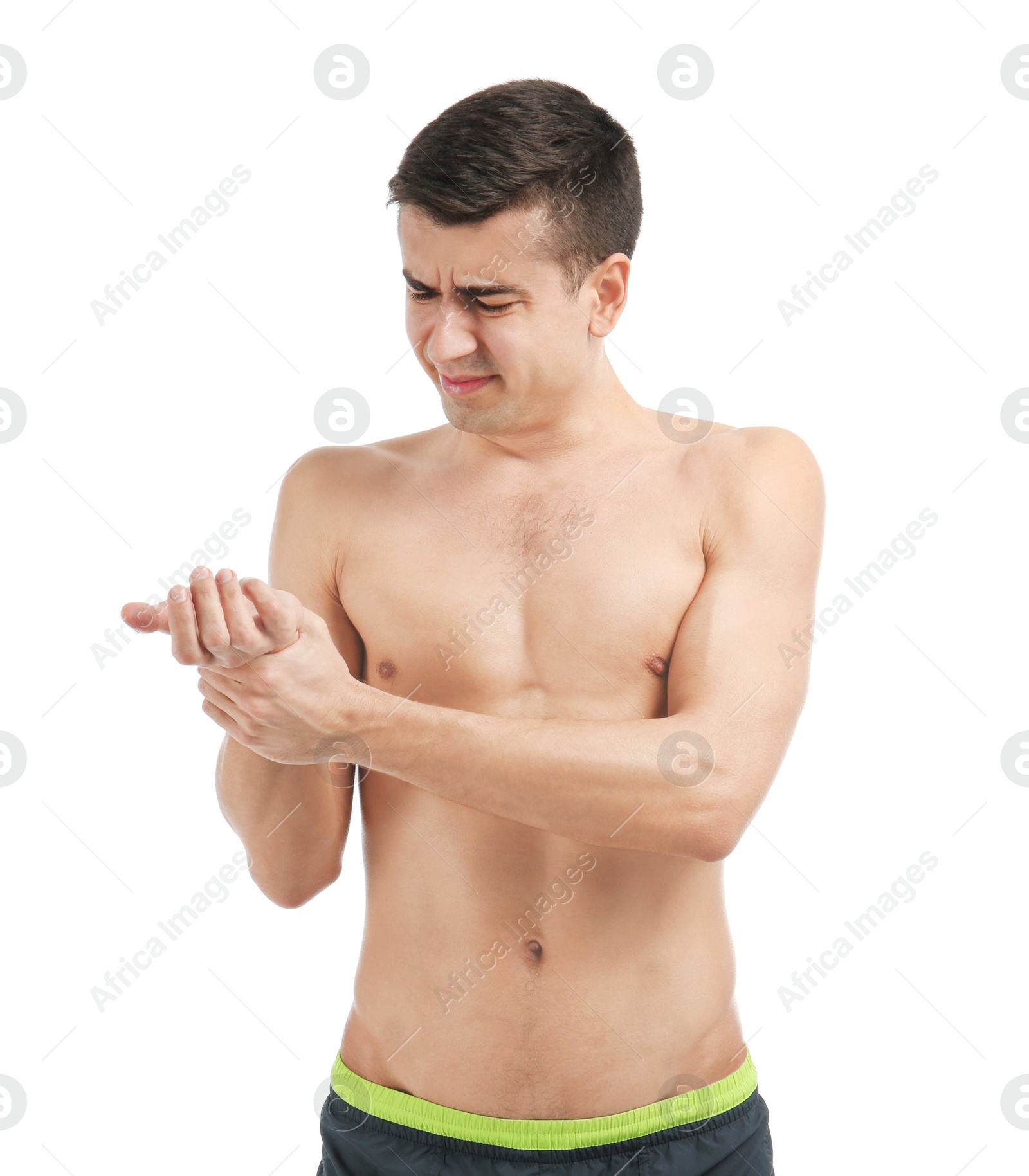 Photo of Young man suffering from pain in wrist on white background