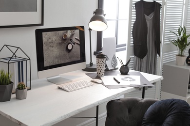 Photo of Stylish workplace with modern computer on desk