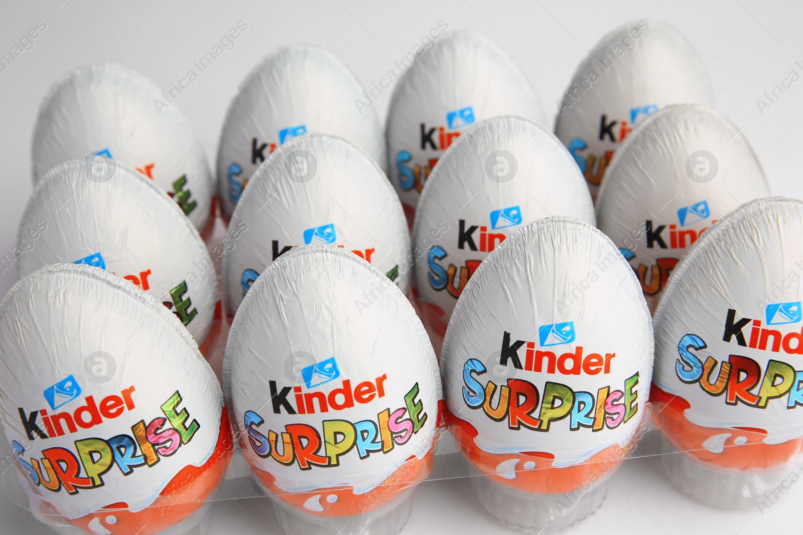 Photo of Sveti Vlas, Bulgaria - June 26, 2023: Kinder Surprise Eggs in plastic tray on white background, closeup