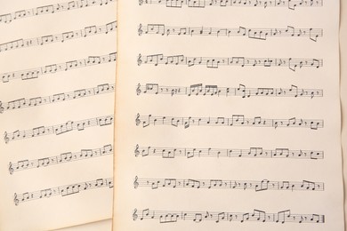 Sheets of paper with different notes as background, top view