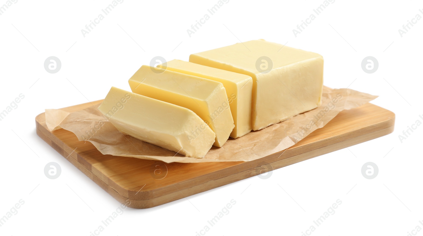 Photo of Wooden board with cut block of butter on white background