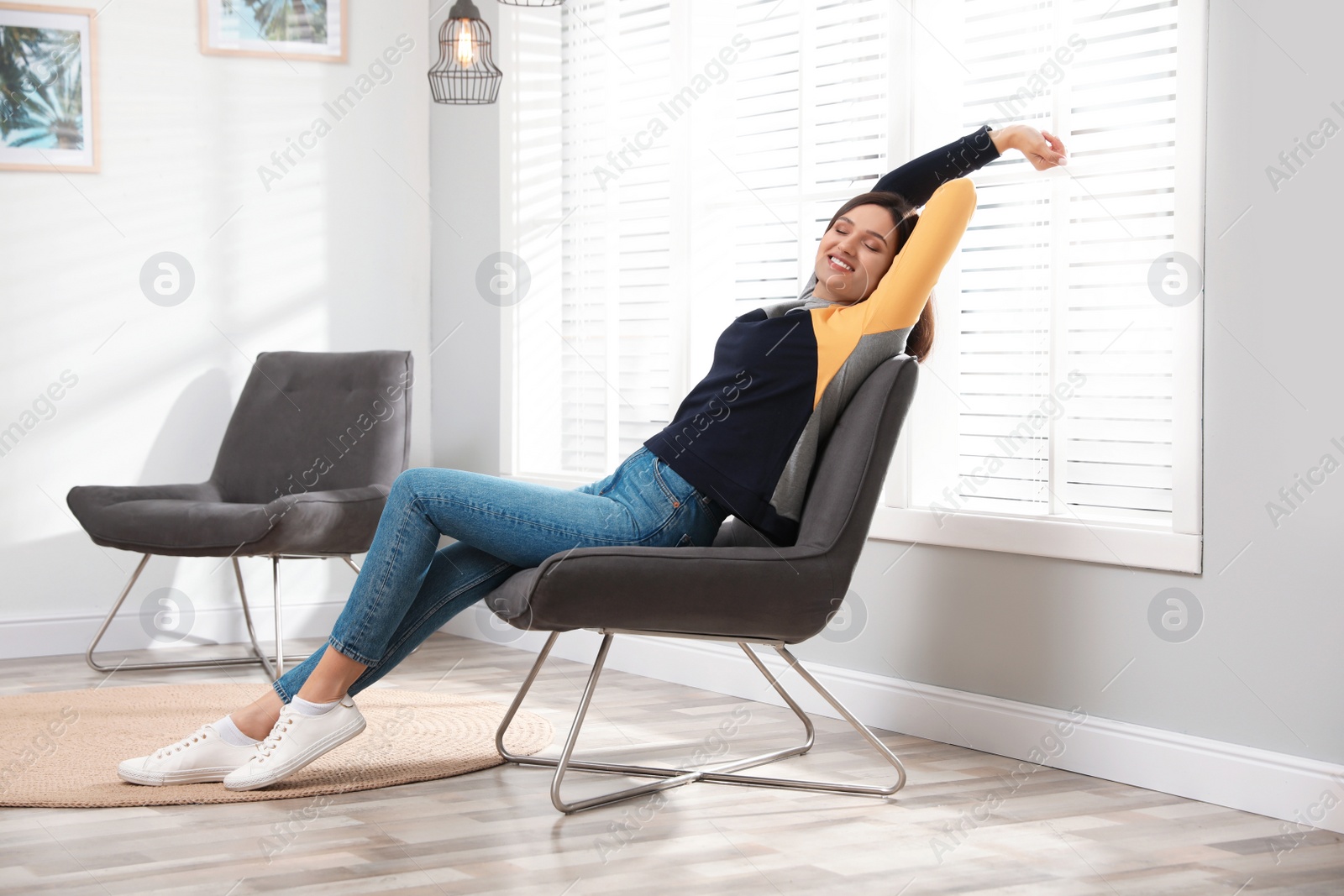 Photo of Young woman relaxing at home. Peaceful rest