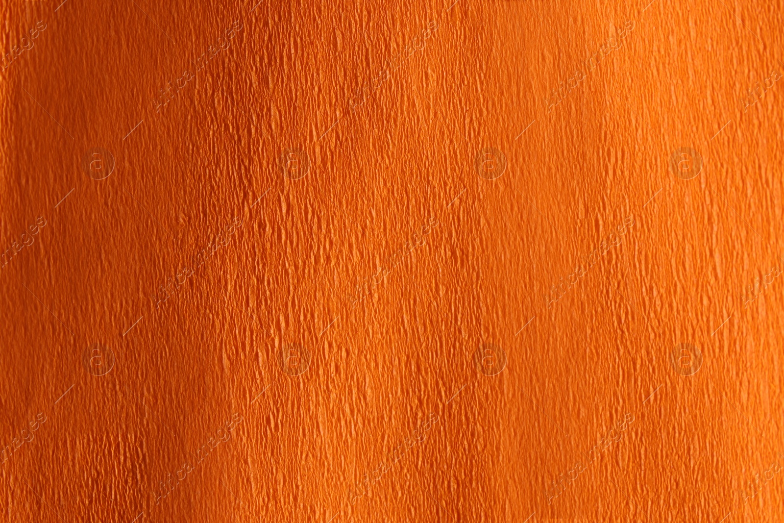 Photo of Orange textured surface as background, closeup view