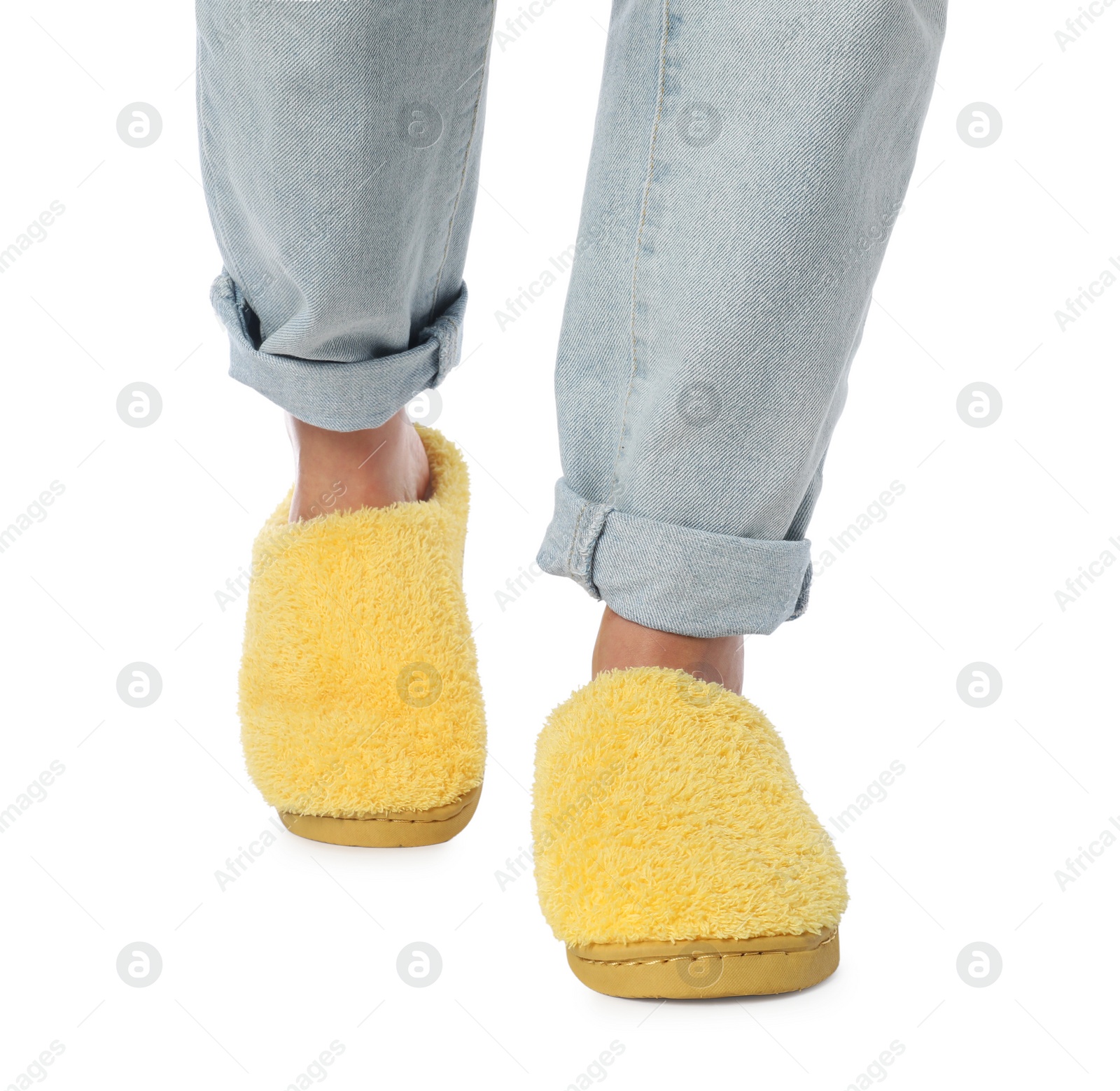 Photo of Woman in yellow soft slippers on white background, closeup