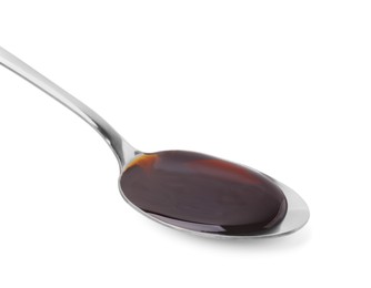 Photo of Spoon with delicious caramel syrup isolated on white