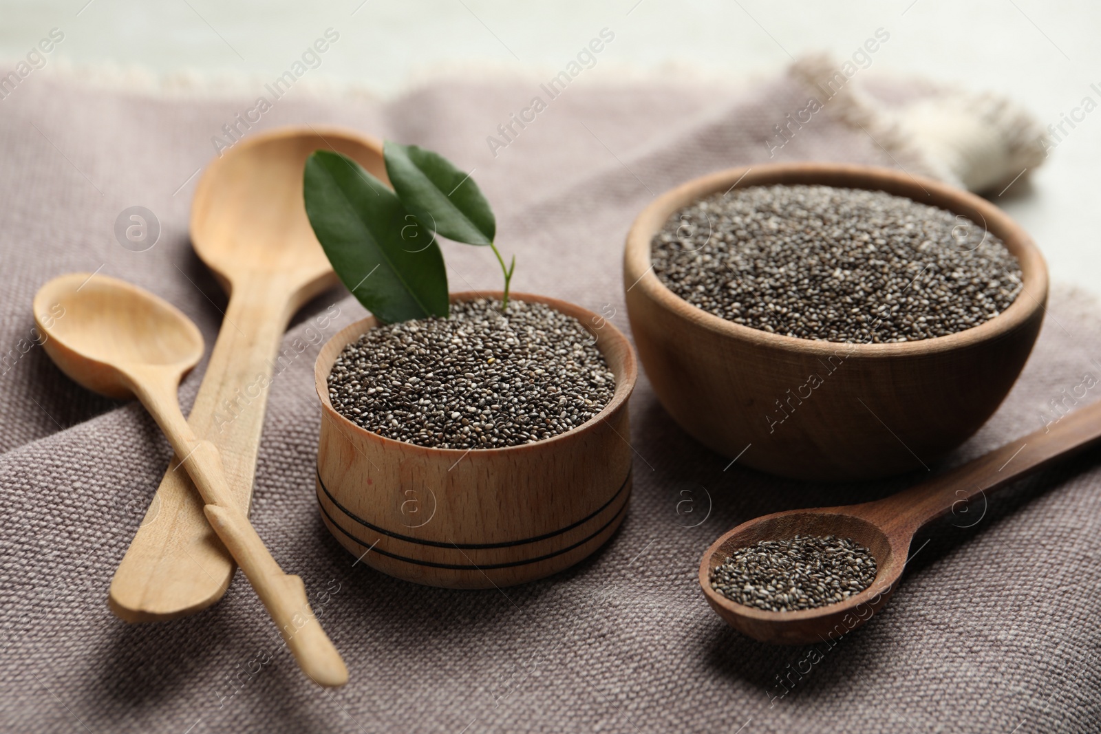 Photo of Composition with chia seeds on grey fabric