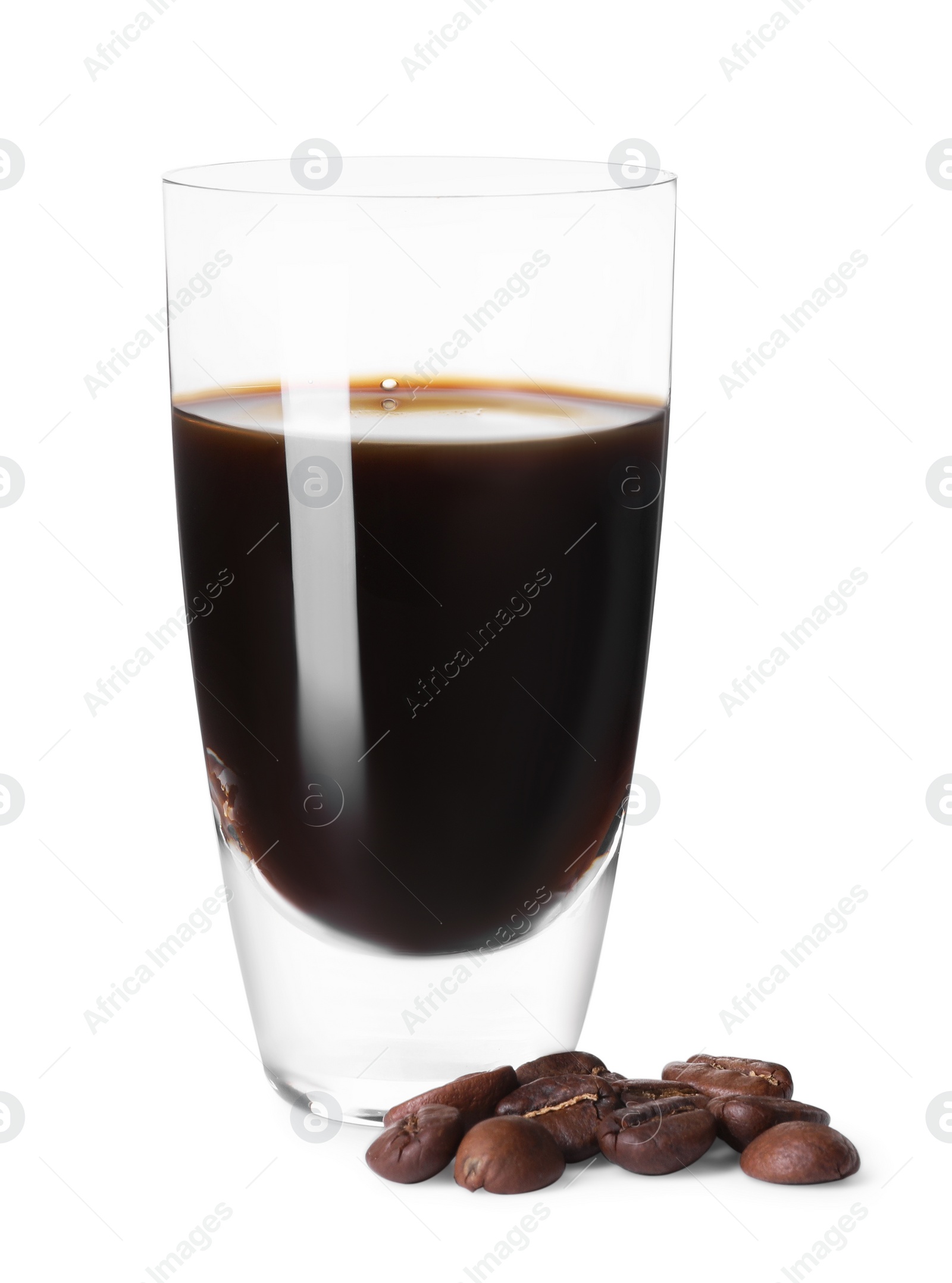 Photo of Shot glass with coffee liqueur and beans isolated on white