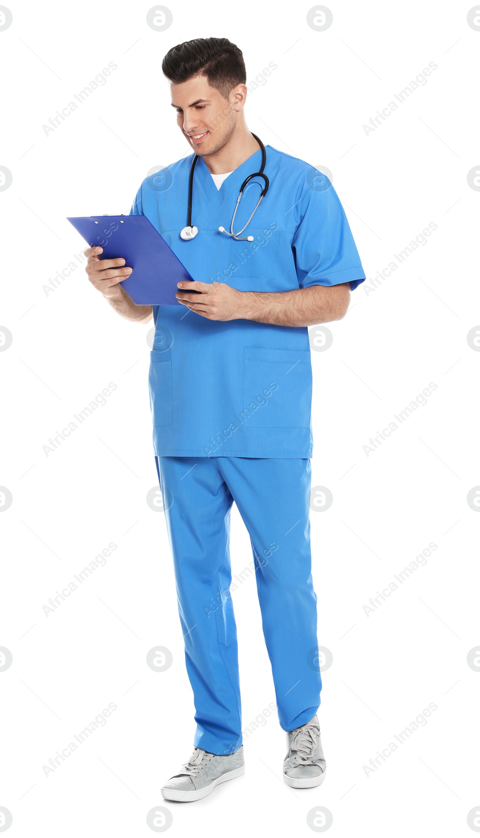 Photo of Full length portrait of medical doctor with clipboard and stethoscope isolated on white