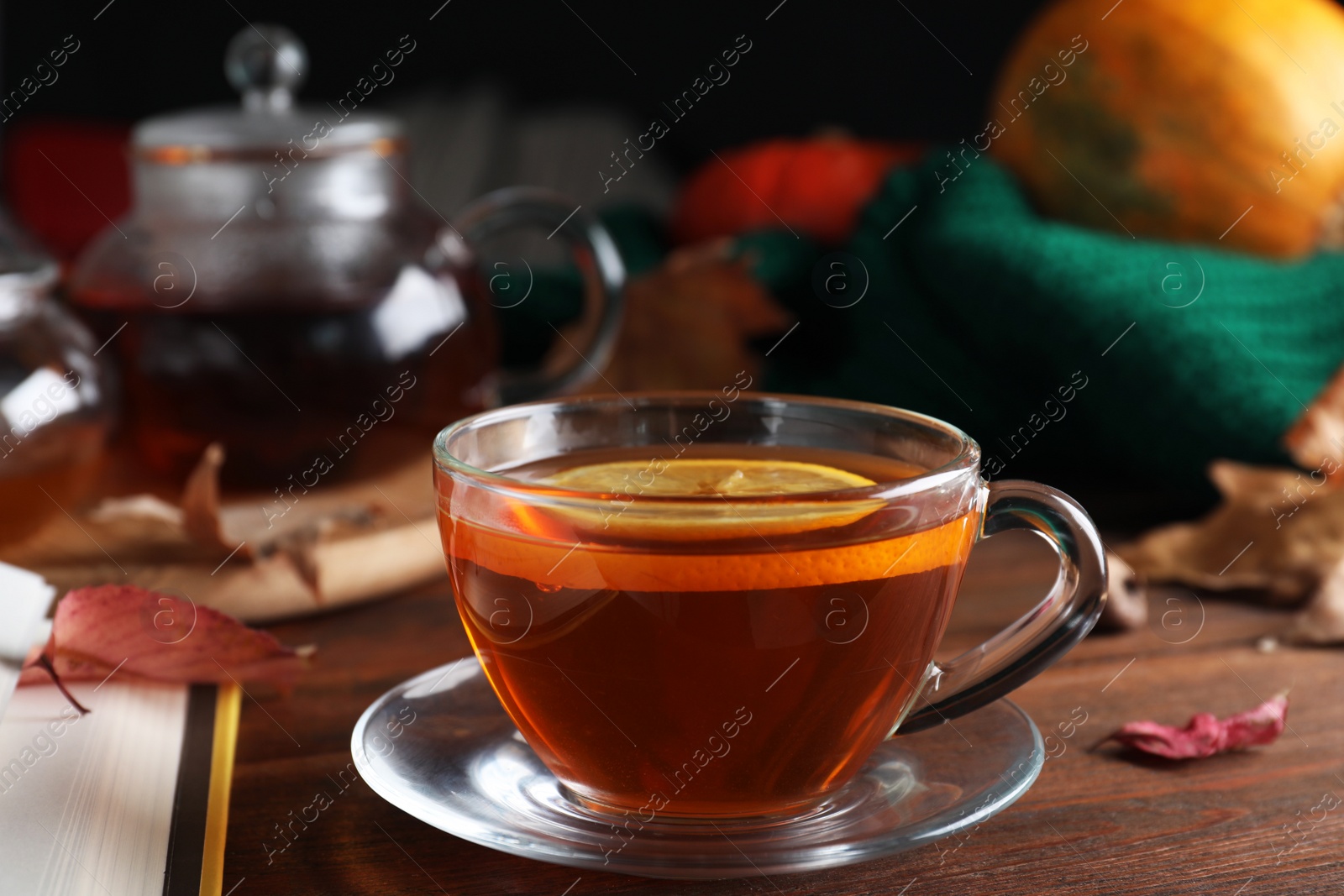 Photo of Cup of hot drink on wooden table. Cozy autumn atmosphere