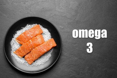 Omega 3. Plate with fresh cut salmon and salt on black table, top view
