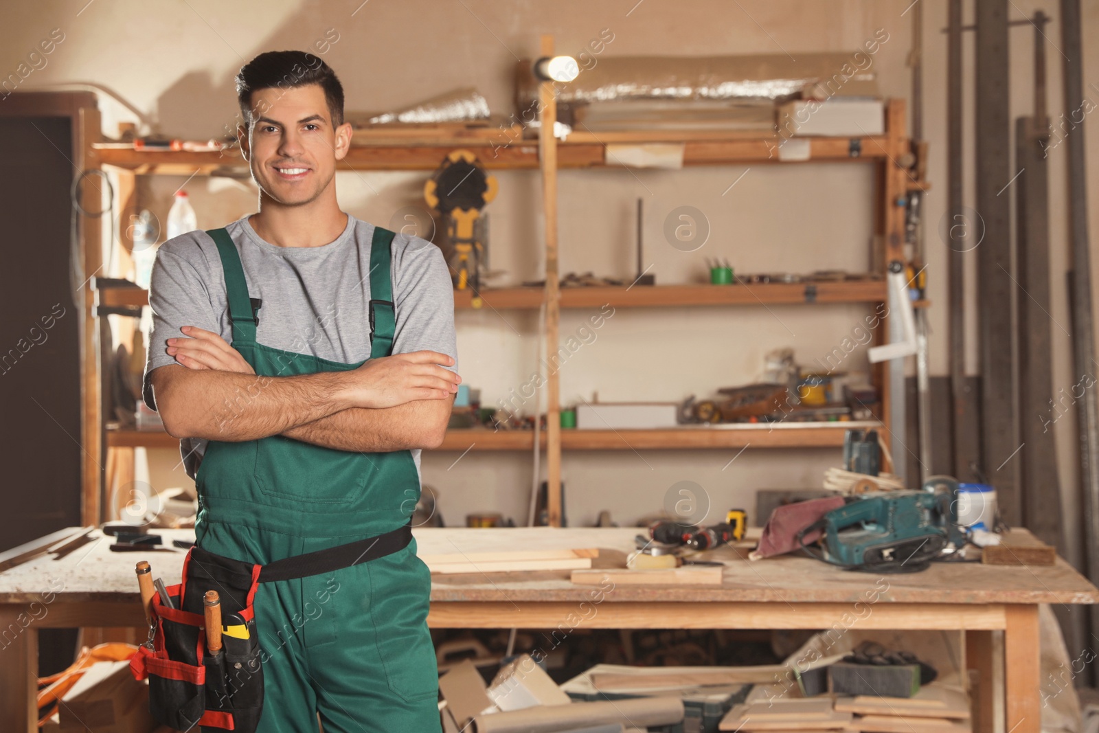 Photo of Professional carpenter with set of tools in workshop