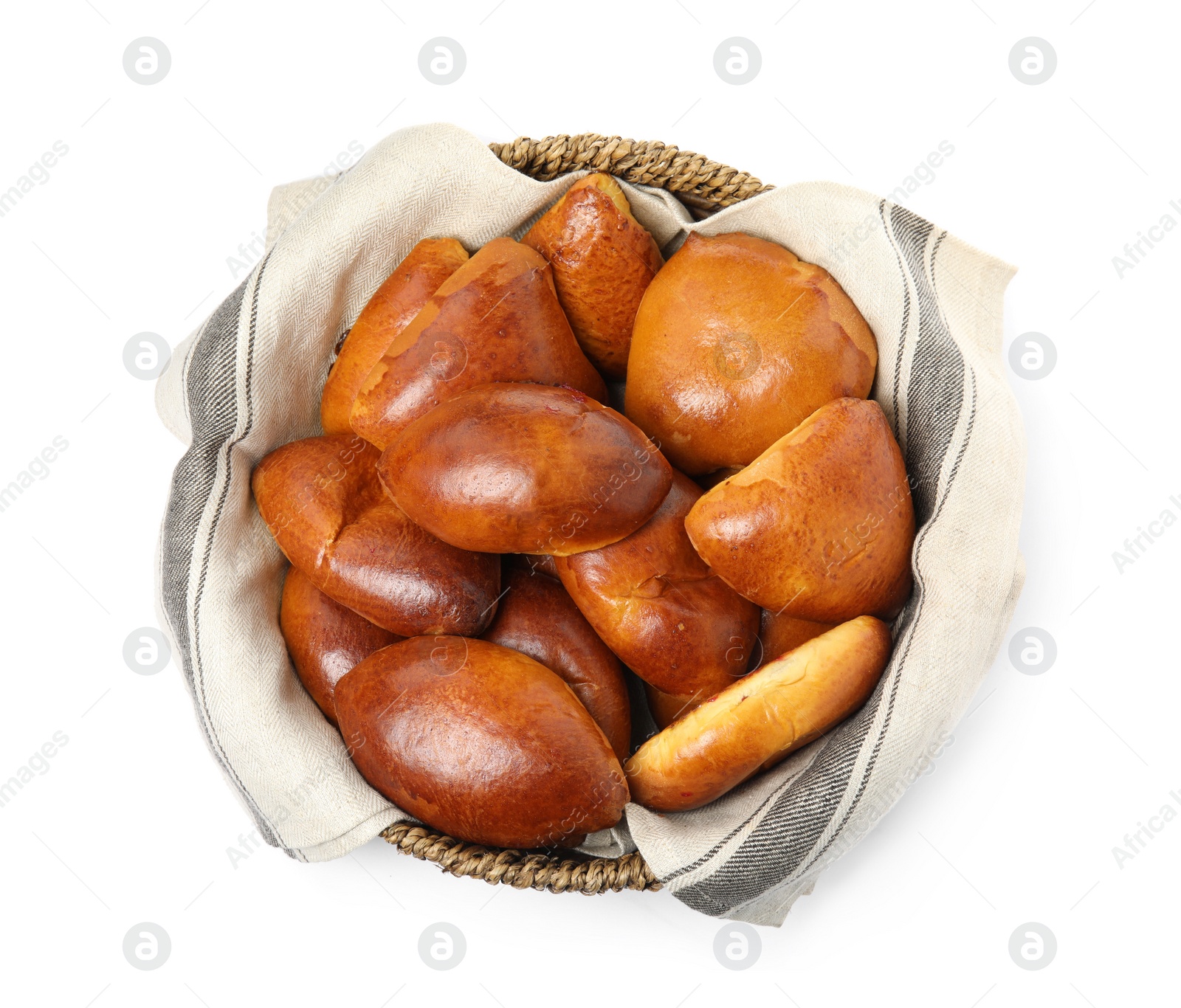 Photo of Wicker basket with delicious baked pirozhki on white background, top view