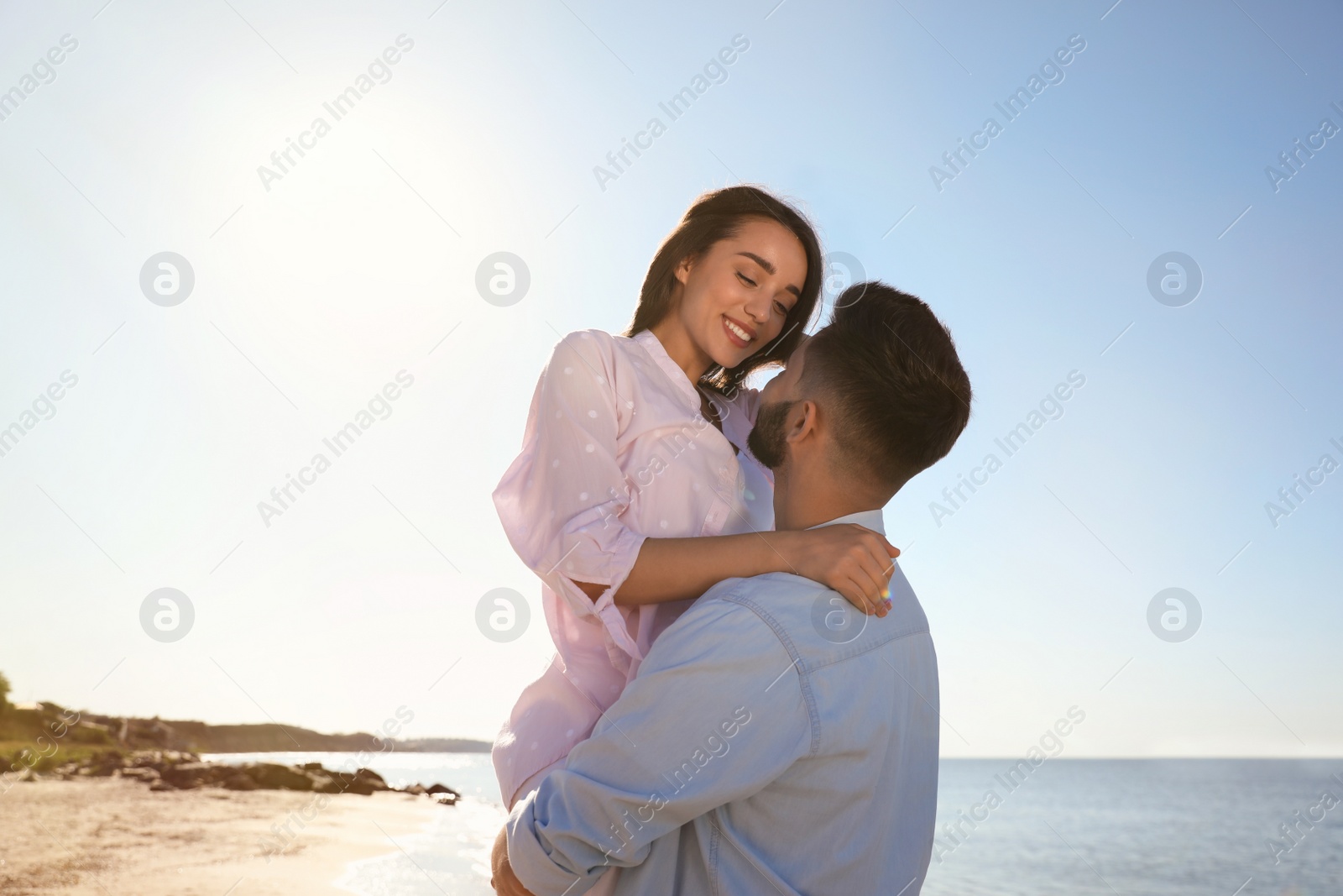 Photo of Happy young couple at beach. Honeymoon trip