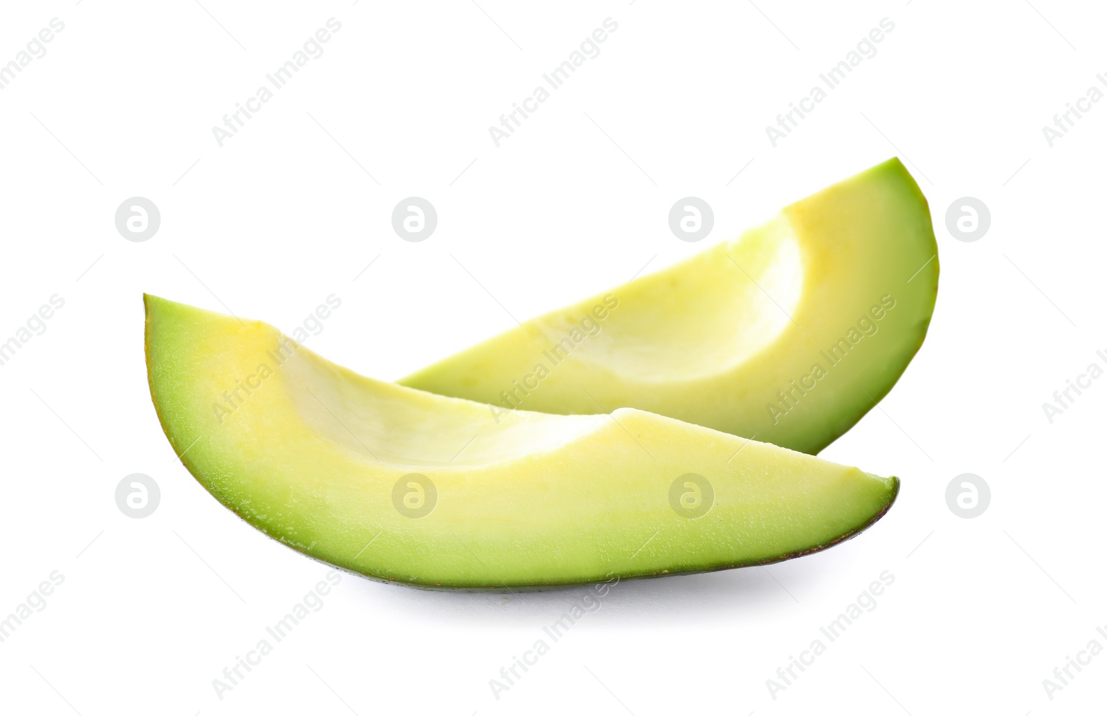 Photo of Slices of ripe avocado isolated on white