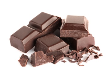 Photo of Pieces of tasty dark chocolate on white background