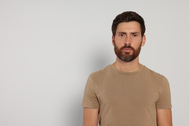 Portrait of handsome bearded man on white background