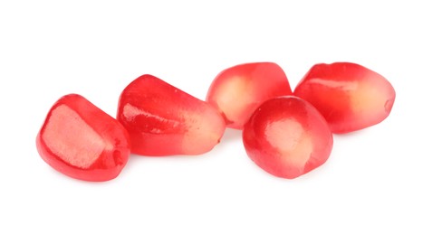 Photo of Juicy red pomegranate seeds on white background